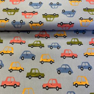 Kokvilnas poplīns krāsaini auto uz gaiši zila fona